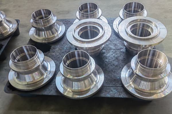 Precision CNC machined steel flange sleeves - custom tight tolerance machined metal parts